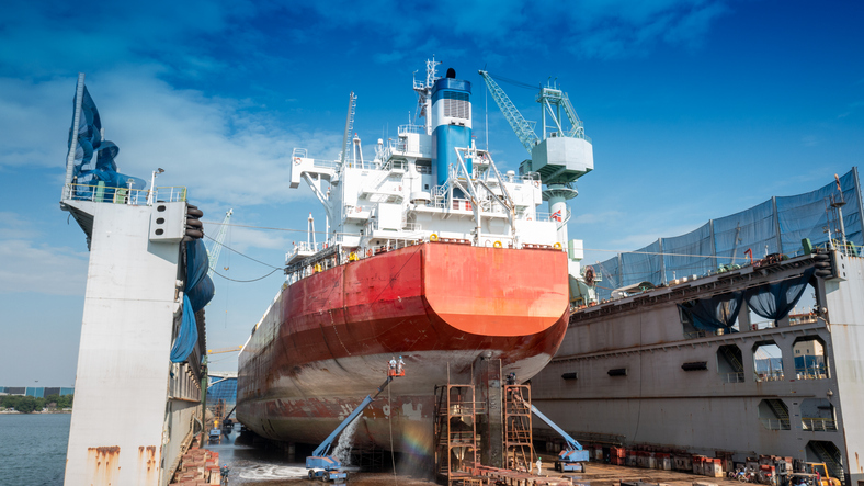 The hull painting consists of washing, blasting and painting of the vessel cargo ship by operator at international dry dock concept maintenance service annual cleaning.